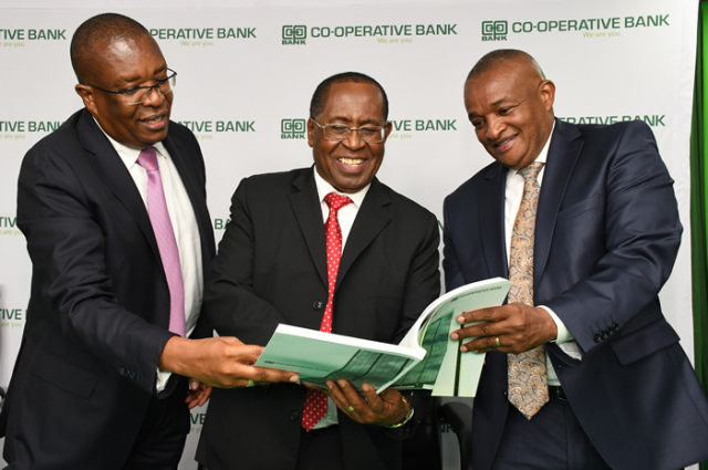 Good Numbers: The Group Managing Director & CEO Dr Gideon Muriuki together with Bank Chairman Mr John Murugu and the Vice Chairman Mr Macloud Malonza go through Co-op Bank’s Annual Report during the bank’s virtual 14th Annual General Meeting held recently.